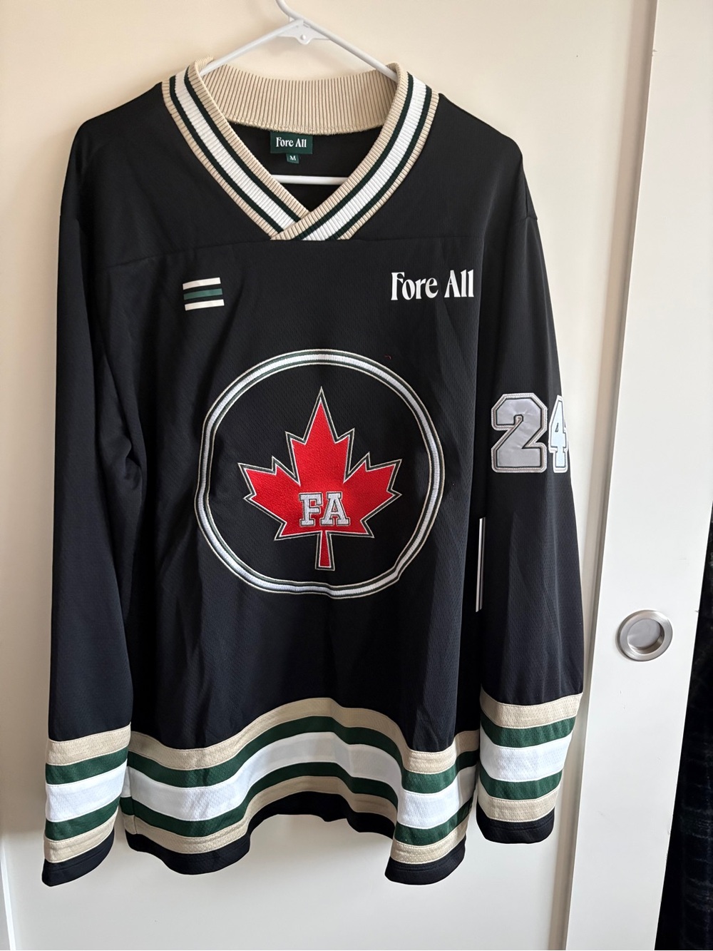Fore All Women's Black Hockey Jersey with Red Maple Leaf